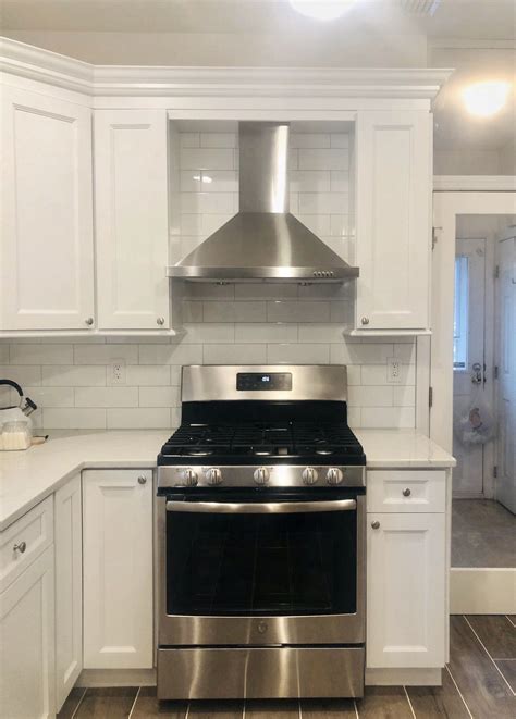 off white kitchen cabinets with stainless steel oven hood|off white kitchen cabinets colors.